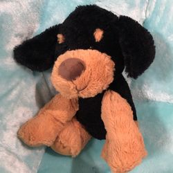 Black and brown stuffed animal dog