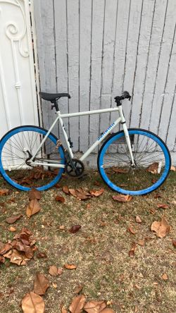 Schwin bike blue rims light gray off white frame with blue schwin logo