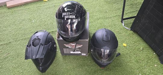 3 helmets: 1 Sedici brand and 2 Harley-Davidson; one is new and features a built-in microphone. Sizes: medium and small.