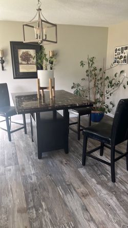 Table and chairs and stool