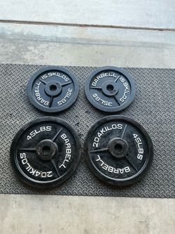 Olympic Barbell Weight Plates Pair 2 x 45 lbs and 2 x 35 lbs.