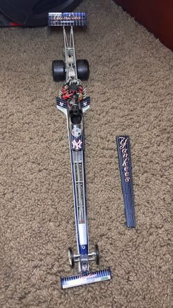 1:24 scale model of a Top Fuel dragster from the Action Racing Collectables brand, decorated with the theme of the New York Yankees (led by Mike Dunn 