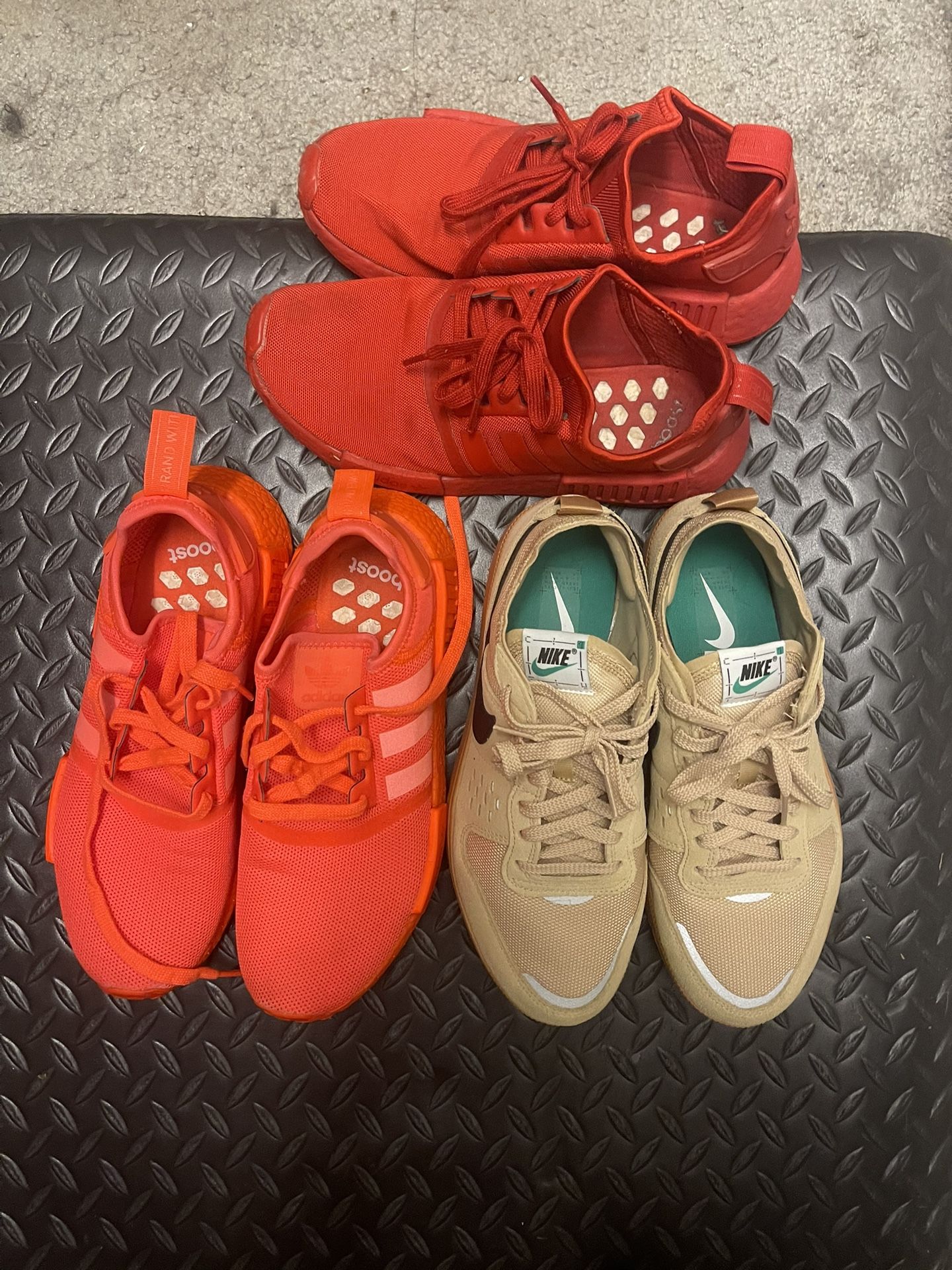3 used pairs of shoes size 9 and 9.5 adidas triple solar red, Nike city brownstone, and adidas red. Located in largo