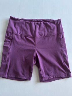 Danskin women's high-rise, stretchy purple cycling shorts, size L.