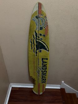 Landshark Island Style Lager Surfboard Wall Plaque Shark. Used in good with some cosmetic blemishes. These blemishes are in the form of some scratche
