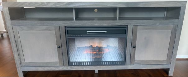 Gray tv console with fireplace