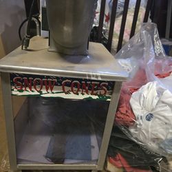 Snow cone making machine