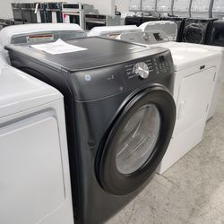 $549(MSRP$1049) GE SMART Electric Front Load Dryer in Carbon With Damp Alert and Reversible Door