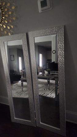 2 silver wall hanging mirrors
