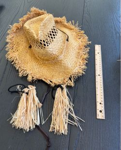 Straw scarecrows hat and ponytail strands to make hair