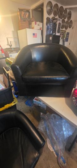 Two Black Faux Leather Barrel Accent Chairs