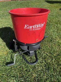 Professional grade Earthway Spreader ( like new used twice) comes with back straps