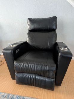 Electric black leather recliner with charger plug