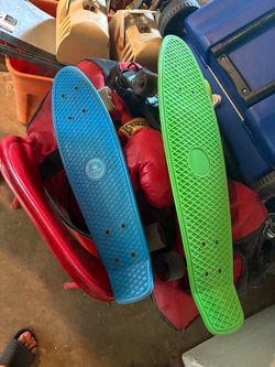 2 skateboards blue one wheels light up when rolling