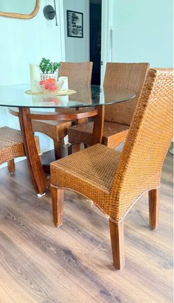 Round Glass Top Dining Table with Wicker Chairs