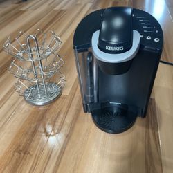 Black Keurig And Coffee Cup Stand