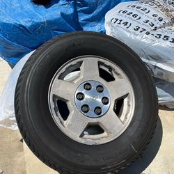 Four Chevy wheels and tires, lots of tread!