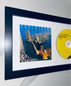 Supertramp “Breakfast In America” cd booklet signed by Rodger Hodgson.