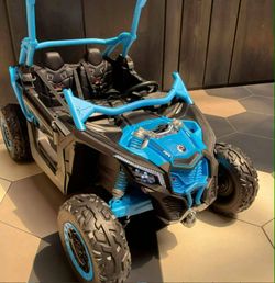 Ride on car electric can am big 2 seater 48volts double battery 4x4 with remote or kids drive there selfs Rubber tires