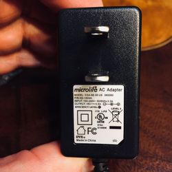 Microlife AC Adapter. Brand new. Never used. Still in original packaging.  Input: 100-240V~50/60Hz 0.3A  Output: 6V 0.6A