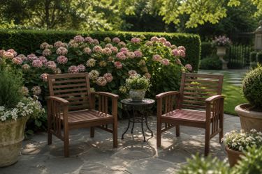 Two wooded patio chairs
