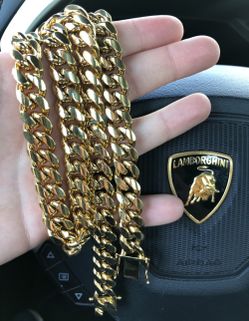 New 14 k yellow gold Cuban link chain and bracelet
