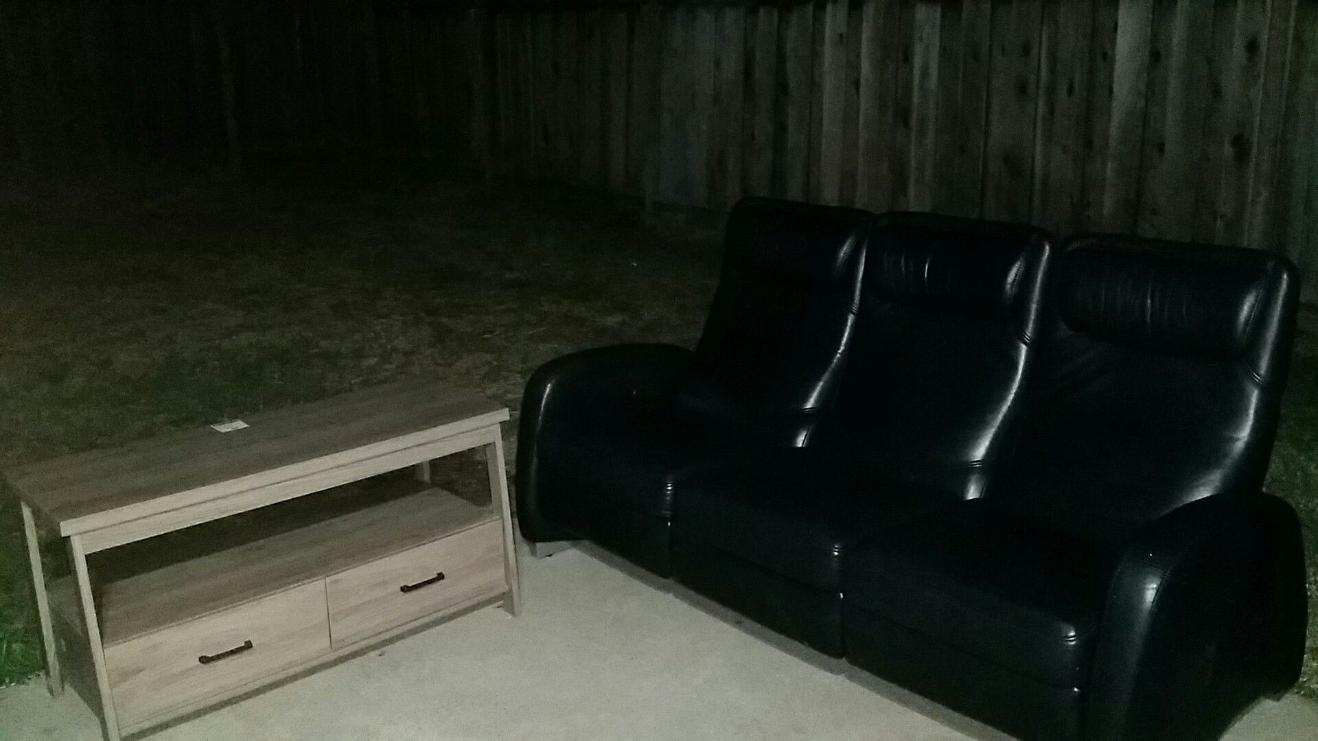 Black leather couch recliner in a good condition with TV Stand table!!