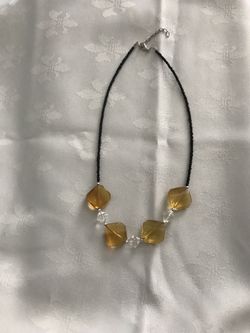 Amber colored and beaded necklace