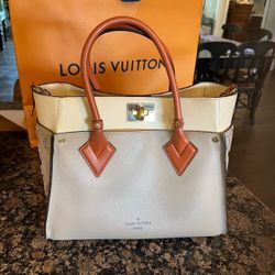 Louis Vuitton on my side MM bag