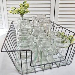 Collection of various glass jars in a vintage metal basket - Best Offer