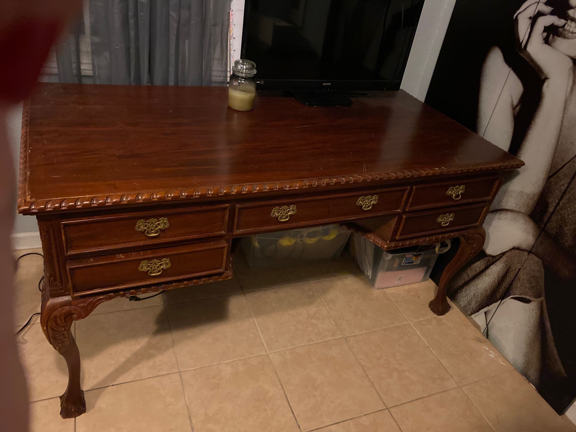 Antique carved wooden desk with drawers