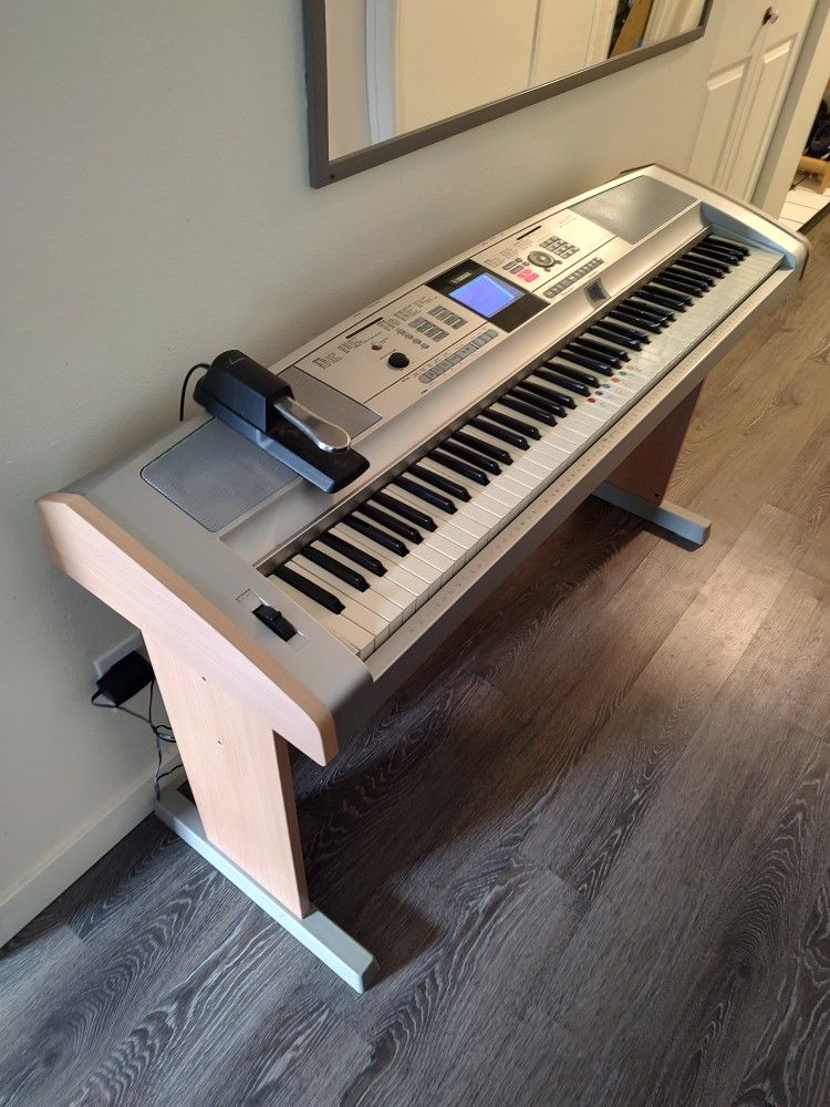 Yamaha Portable Lightly Weighted 88-Key Grand Piano Keyboard + Pedal/Stand + 494 voices, 135 Accompaniment, 32-note Polyphony, 6-track Seq (MSRP $899)