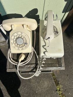 Two vintage ivory color telephones in good condition. One is a desk phone. The other is a wall mount Phone.   Both still work.   $40 each or both for 