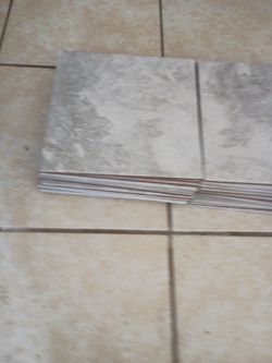24 Pieces of grey floor tiles 12"/ 12"