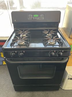 GE four burner gas black stove