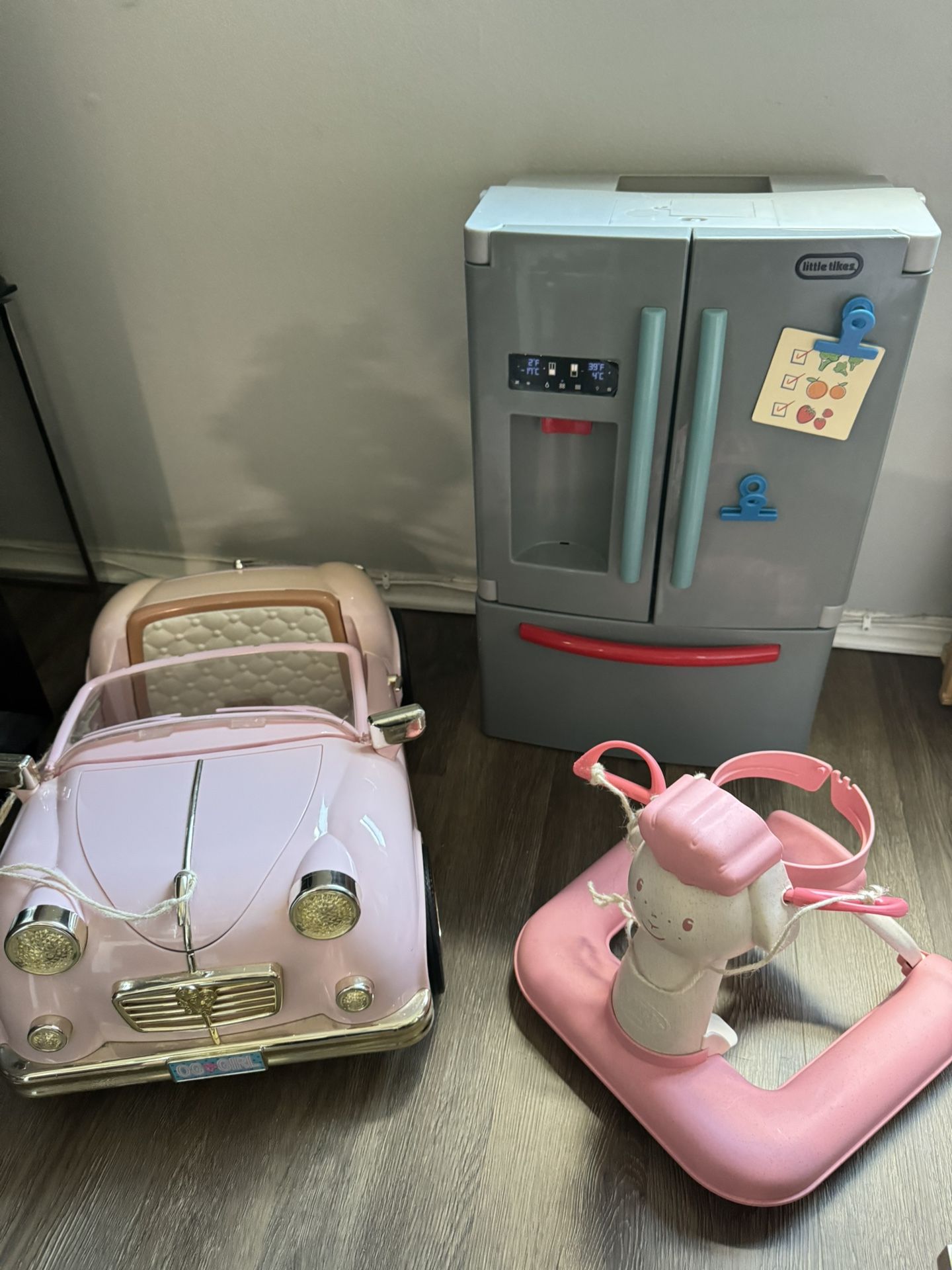 refrigerator, car and walker for dolls.