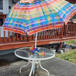 Glass Table With Colorful Tilting Umbrella 