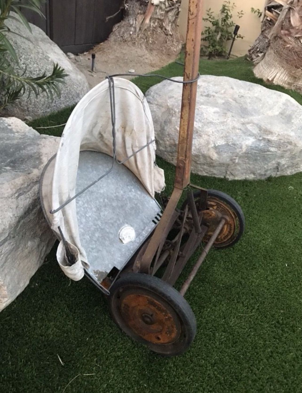 Antique push reel mower with bag