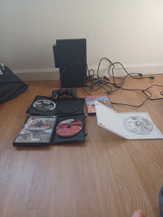 Working Ps2 With A Bundle Of Games Comes With 1 Controller