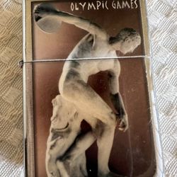 Robinson Wind II Lighter With Disk Thrower Figure Patina And The Inscription “OLYMPIC GAMES”