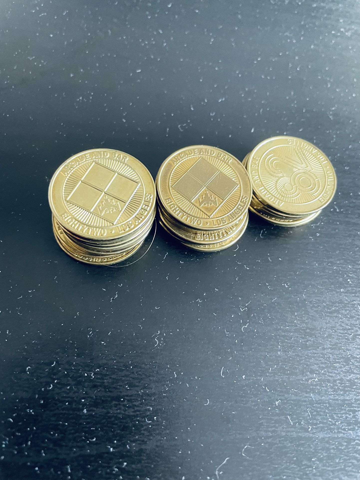 22 of EightyTwo arcade coins