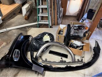 Nissan Titan XD parts lot cheap fender headlight navigation interior trim floor mats over fender Cummins turbo