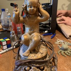 Antique Metal Lamp Of A young Girl