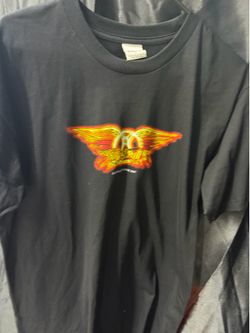 black Aerosmith shirt features the "Aeroforce One Tour 2007" logo with a fiery winged graphic