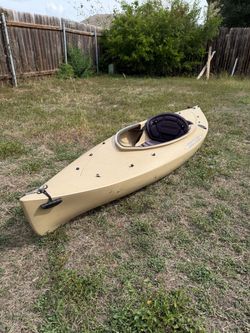 Fishing kayak, rod holders included along with paddle