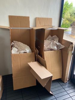 Moving cardboard boxes and paper