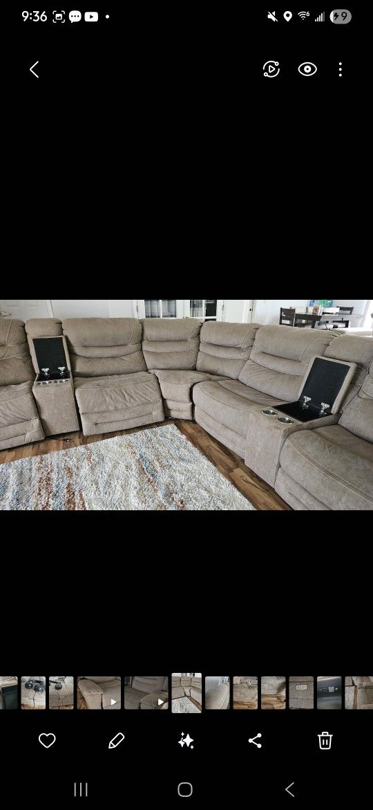 Large electronic Sectional With charging stations and storage.