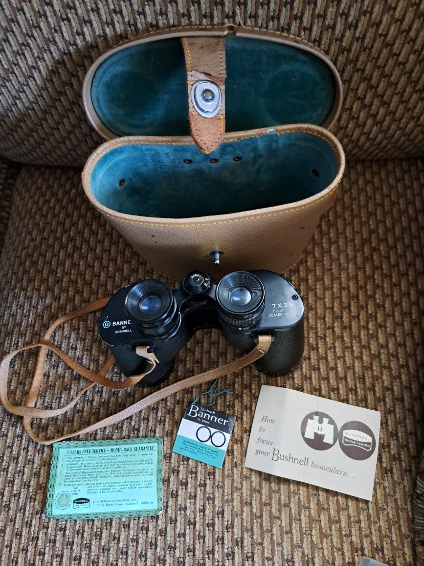 Vintage Bushnell Binoculars from 1960 with original case and paperwork also has original strap