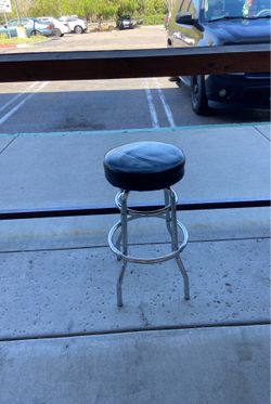 Black round spinning bar stool