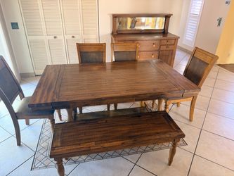 Brown wood dining table with bench and leafs